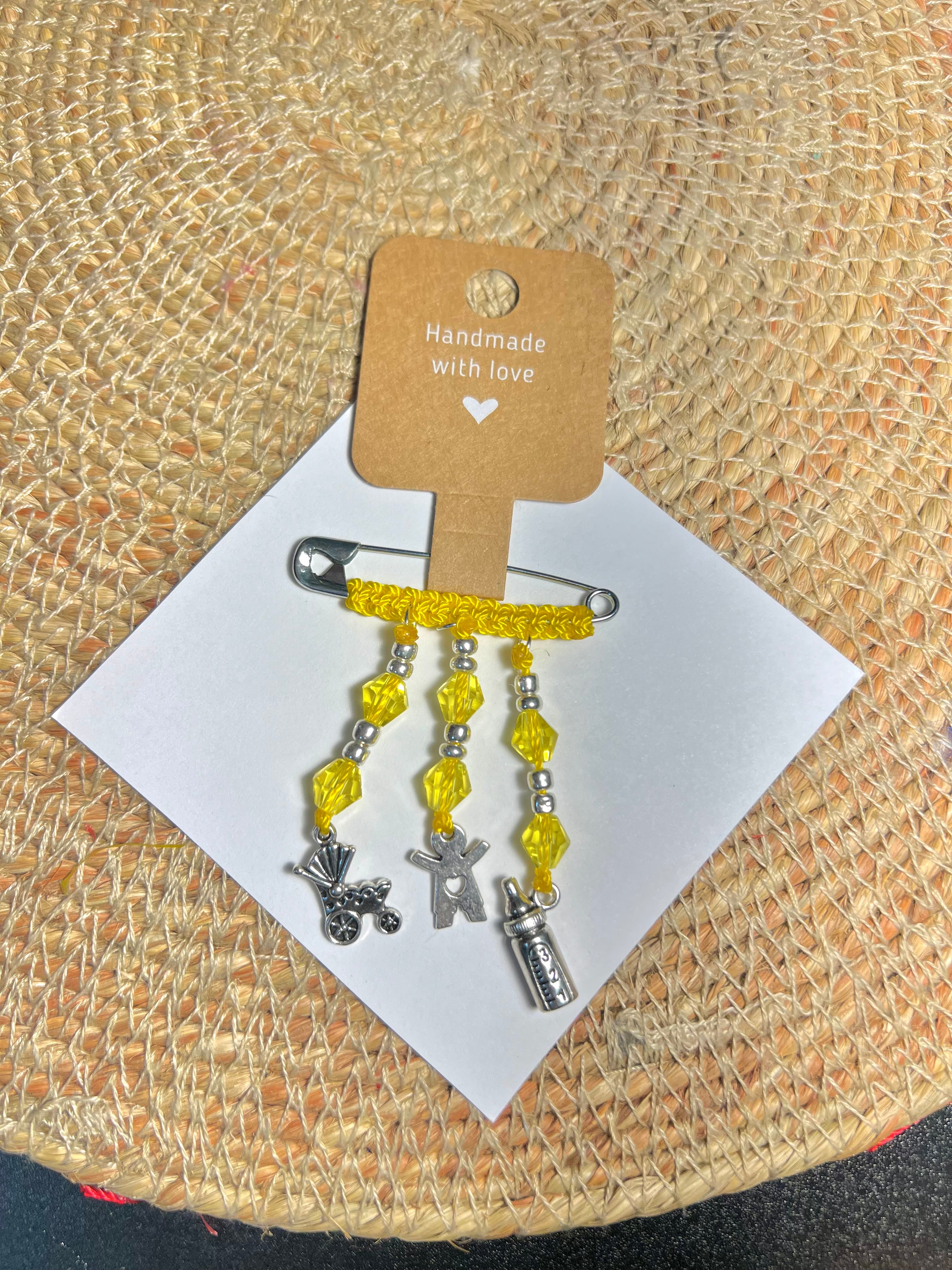 Yellow safety-pin